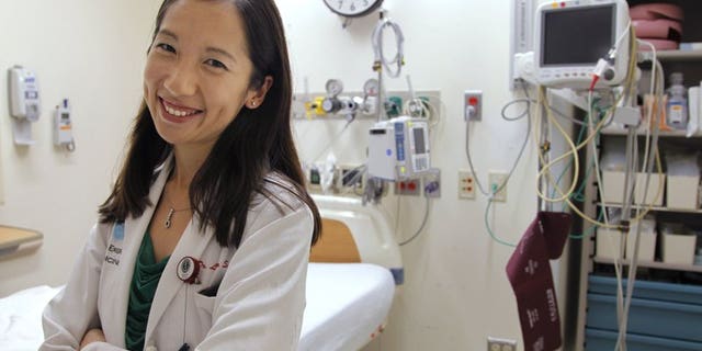 In this Aug. 14, 2012 file photo, Dr. Leana Wen stands in the emergency department at Brigham and Women’s Hospital in Boston, during her medical residency. On Wednesday, Sept. 12, 2018, Wen, an immigrant from China who has been Baltimore’s health commissioner for nearly four years, was named as the new president of Planned Parenthood.