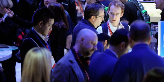 LAS VEGAS, NV - JANUARY 09: Attendees crowd around the Intel booth at the 2013 International CES at the Las Vegas Convention Center on January 9, 2013 in Las Vegas, Nevada. CES, the world's largest annual consumer technology trade show, runs through January 11 and is expected to feature 3,100 exhibitors showing off their latest products and services to about 150,000 attendees. (Photo by David Becker/Getty Images)
