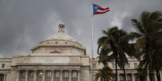 The Puerto Rican flag flies near the Capitol building. (Photo by Joe Raedle/Getty Images)