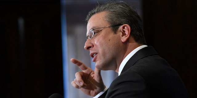 FILE - In this Dec. 16, 2015, file photo, Puerto Rico Gov. Alejandro Javier Garcia Padilla speaks at a luncheon at the National Press Club in Washington. Puerto Rico's governor unveiled a stark budget Monday, May 23, 2016, that sets aside more than $200 million for a critical bond payment as the U.S. territory sinks into a deep economic crisis. (AP Photo/Sait Serkan Gurbuz,File)