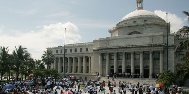 SAN JUAN, PUERTO RICO - APRIL 28: (PUERTO RICO OUT) Tens of thousands march towards the Capitol building April 28, 2006 in San Juan, Puerto Rico, demanding the legislature to approve a line of credit that would avoid the goverment from shutting down May 1, 2006 affecting over 200,000 public employees. The demonstration was called "Puerto Rico Grita" or "Scream Puerto Rico". (Photo by Jose Jimenez-Tirado/Getty Images)