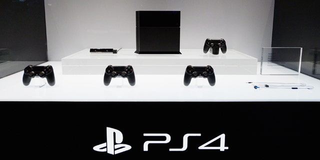 LOS ANGELES, CA - JUNE 11: A Playstation 4 and its controllers on display at the Sony Playstation E3 2013 booth at the Los Angeles Convention Center on June 11, 2013 in Los Angeles, California. Thousands are expected to attend the annual three-day convention to see the latest games and announcements from the gaming industry. (Photo by Kevork Djansezian/Getty Images)