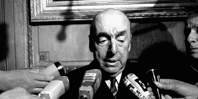 FILE - This Oct. 21, 1971 file photo shows Pablo Neruda, poet and then Chilean ambassador to France, talk with reporters in Paris after being named the 1971 Nobel Prize for Literature. Chileâs government is acknowledging that Neruda might have been killed after the 1973 coup that brought Gen. Augusto Pinochet to power. The Chile's Interior Ministry released a statement Thursday, Nov. 5, 2015, amid press reports that Neruda might not have died of cancer . (AP Photo/Laurent Rebours, File)