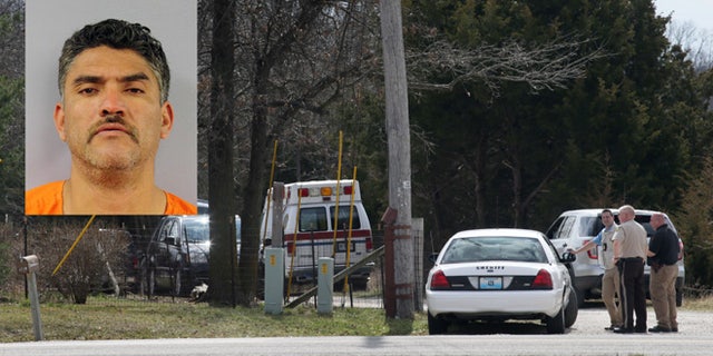 Police gather near the house where a man was found murdered on Tuesday, March 8, 2016, near New Florence, Mo., just south of Interstate 70 near the intersection of Highway 19. Dozens of officers searched farmland in central Missouri on Tuesday for a man suspected of killing a man at a nearby house just hours after fatally shooting several people at his neighbor's home about 170 miles away in Kansas. (Cristina Fletes/St. Louis Post-Dispatch via AP) EDWARDSVILLE INTELLIGENCER OUT; THE ALTON TELEGRAPH OUT; MANDATORY CREDIT