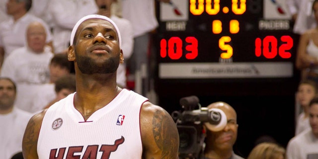Miami Heat forward LeBron James (6) scored in the last seconds of overtime to defeat the Indiana Pacers in Miami on Tuesday May 22, 2013. (AP Photo/The Palm Beach Post, Allen Eyestone)