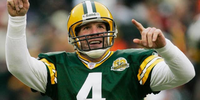 FILE - In this Dec. 9, 2007 file photo, Green Bay Packers quarterback Brett Favre reacts to a 46-yard touchdown pass to tight end Donald Lee during the second half of an NFL football game against the Oakland Raiders in Green Bay, Wis. Favre will be inducted into the team's Hall of Fame and have his jersey retired next year. Favre writes on his official website that it will be an honor to have his name placed among others such Bart Starr, Curly Lambeau, Ray Nitschke and Vince Lombardi, to name a few. (AP Photo/Morry Gash, File)