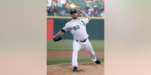 Chicago White Sox starting pitcher John Danks delivers during the first inning of an interleague baseball game against the San Diego Padres on Friday, May 30, 2014, in Chicago. (AP Photo/Charles Rex Arbogast)