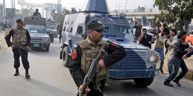 Feb. 11, 2011: An armored car carrying Raymond Allen Davis, a U.S. consulate employee suspected in a shooting, leaves a court in Lahore, Pakistan