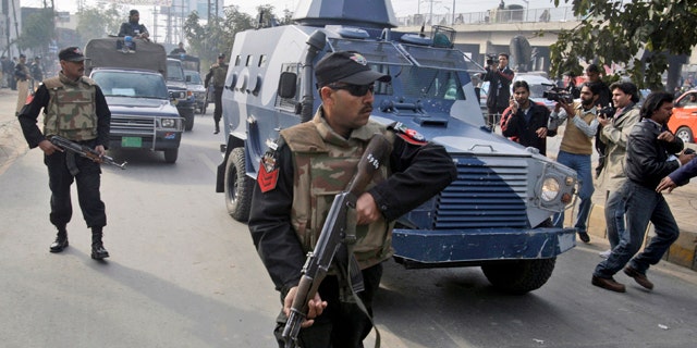 Feb. 11, 2011: An armored car carrying Raymond Allen Davis, a U.S. consulate employee suspected in a shooting, leaves a court in Lahore, Pakistan