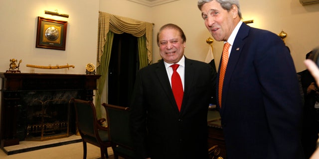 Jan. 12, 2015: U.S. Secretary of State John Kerry is greeted by Pakistan Prime Minister Nawaz Sharif shortly after arriving in Islamabad. (AP Photo/Rick Wilking, Pool)