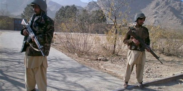 Dec. 18, 2010: Pakistani paramilitary soldiers stand guard at a checkpoint in Sadukheil village near Landi Kotel, in Pakistan's Khyber tribal region along the Afghan border.