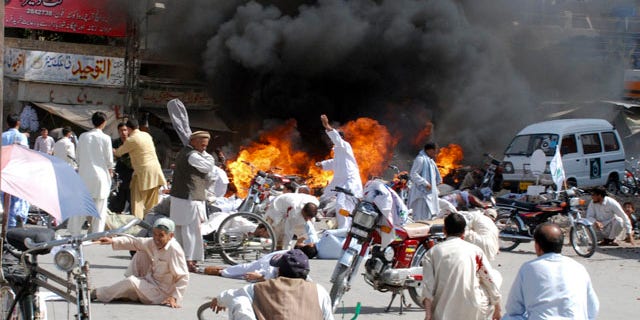 September 3: Injured people lie down on road after an explosion during a Shiite procession in Quetta, Pakistan. Police say a blast at a Shiite procession has killed many people in southwestern Pakistan in the third deadly attack this week on the country's religious minorities. (AP)