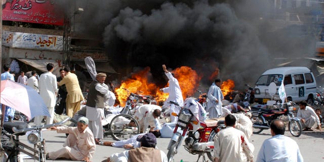 September 3: Injured people lie down on road after an explosion during a Shiite procession in Quetta, Pakistan. Police say a blast at a Shiite procession has killed many people in southwestern Pakistan in the third deadly attack this week on the country's religious minorities. (AP)