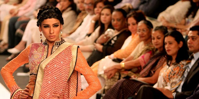 Nov. 7: A model displays a creation by Pakistani designer Faiza Samee during the Pakistan Fashion Week in Karachi, Pakistan.