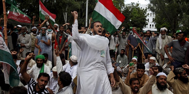 September 1, 2014: Supporters of anti-government Muslim cleric Tahir-ul-Qadri chant slogans during a protest close to the Prime Minister's home in Islamabad, Pakistan. (AP Photo/Anjum Naveed)