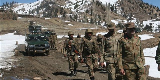 March 2011: Pakistan army soldiers patrol in the Pakistani tribal area of Ditta Kheil in North Waziristan where the Pakistan army are fighting against militants and al-Qaida activists along the Afghanistan border.