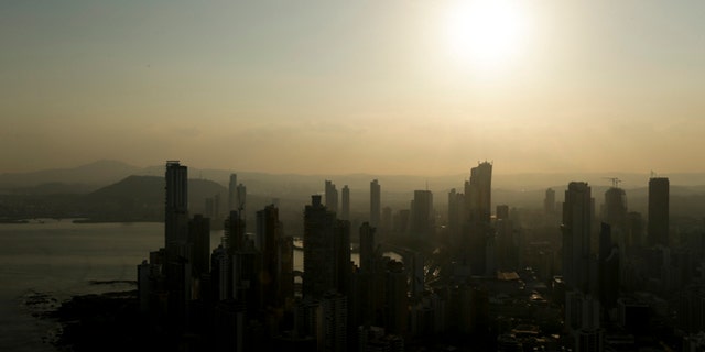 Panama City skyline is silhouette at sunset in Panama, Monday, April 4, 2016.