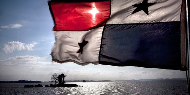 Caption:A flag flying from a ship on the Panama Canal, 5th January 2012. (Photo by Francis Tsang/Cover/Getty Images)