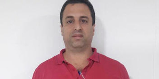 This photo released by Colombias National Police shows Panama businessman Nidal Waked after he was arrested at the international airport in Bogota, Colombia, Wednesday, May 4, 2016. Waked is sought by the United States, accused of being a leader of an organization that laundered drug profits through a web of companies including a luxury mall, a bank and the duty-free zone at Panama City's international airport. (AP Photo/Colombia's National Police)