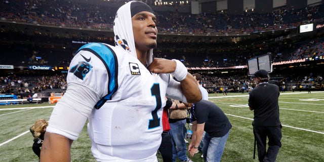 Carolina Panthers quarterback Cam Newton (1) walks on the field after an NFL football game against the New Orleans Saints in New Orleans, Sunday, Dec. 6, 2015. The Panthers won 41-38. (AP Photo/Bill Feig)
