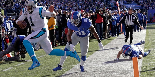 Carolina Panthers quarterback Cam Newton (1) is forced out of bounds by New York Giants' Landon Collins (21) during the first half of an NFL football game Sunday, Dec. 20, 2015, in East Rutherford, N.J. (AP Photo/Julie Jacobson)