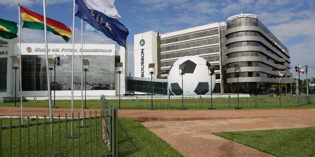 FILE - In this June 3, 2015 file photo, CONMEBOL headquarters sits on a 100-acre complex and includes a museum, a five-star luxury hotel, a large convention center and heliport, in Asuncion, Paraguay. Paraguay's president signed a law on Thursday, June 25, 2015 repealing the immunity that this headquarters enjoyed for nearly two decades, part of the fallout from a U.S. investigation into an alleged bribery scheme in FIFA. (AP Photo/Jorge Saenz, File)
