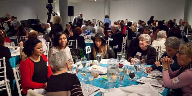 In this Wed., March 25, 2015 photo provided by Matthew Christopher, participants attend Freedom Seder Revisited at the National Museum of American Jewish History in Philadelphia. The event embraces gentiles for an evening of storytelling, music and a taste of traditional Passover food and rituals as it honors the original interfaith Freedom Seder held in 1969 in Washington, D.C., on the first anniversary of Martin Luther King Jr.’s assassination. (AP Photo/Courtesy Matthew Christopher)
