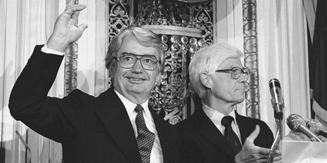 FILE- In this Aug. 25, 1980 file photo, Wisconsin Gov. Patrick J. Lucey, left, waves to the audience at the National Press Club in Washington after Independent presidential candidate John B. Anderson of Illinois, right, announced Lucey would be his vice presidential running mate. Lucey, a hard-nosed Democratic politician who later became ambassador to Mexico, died Saturday, May 10, 2014. He was 96. (AP Photo/File)