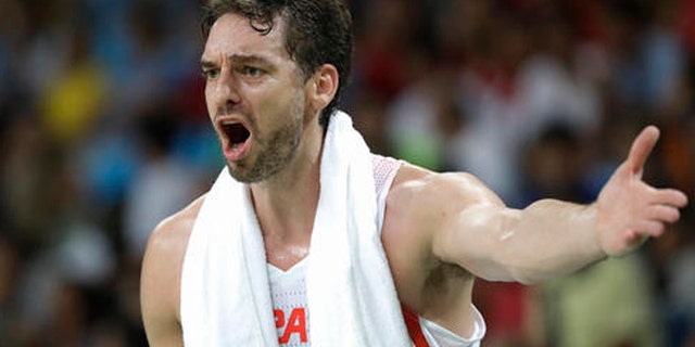 Spain's Pau Gasol (4) questions a call during a men's semifinal round basketball game against the United States at the 2016 Summer Olympics in Rio de Janeiro, Brazil, Friday, Aug. 19, 2016. (AP Photo/Eric Gay)