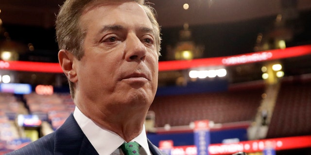 FILE - In this July 17, 2016 file photo, then- Donald Trump campaign chairman Paul Manafort talks to reporters on the floor of the Republican National Convention in Cleveland. Manafort will register with the Justice Department as a foreign agent for lobbying work he did on behalf of Ukraine, led at the time by a pro-Russian political party, his spokesman said Wednesday, April 12. (AP Photo/Matt Rourke)