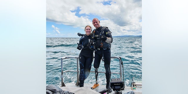 Ronda Rousey and Paul de Gelder pose before their dive beneath the waters off the Fiji coast. "Ronda Rousey Uncaged" airs Monday, as part of Discovery Channel's annual Shark Week.