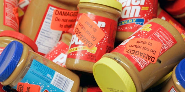 ** FILE **  Returned jars of Peter Pan Peanut Butter are shown at a super market, in this Feb. 16, 2007, file photo in Atlanta. ConAgra Foods Inc. has extended its recall of all peanut butter produced at a plant in Georgia by more than a year, back to October 2004, the Food and Drug Administration said Friday, March 9, 2007.  (AP Photo/John Bazemore, file)
