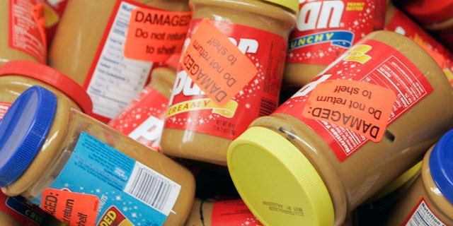 ** FILE ** Returned jars of Peter Pan Peanut Butter are shown at a super market, in this Feb. 16, 2007, file photo in Atlanta. ConAgra Foods Inc. has extended its recall of all peanut butter produced at a plant in Georgia by more than a year, back to October 2004, the Food and Drug Administration said Friday, March 9, 2007. (AP Photo/John Bazemore, file)