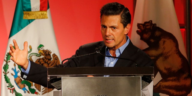 Mexico's President Enrique Pena Nieto speaks to Mexican-American community leaders and others in Los Angeles, Monday, Aug. 25, 2014. (AP Photo/Damian Dovarganes)