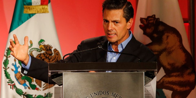 Mexico's President Enrique Pena Nieto speaks to Mexican-American community leaders and others in Los Angeles, Monday, Aug. 25, 2014. (AP Photo/Damian Dovarganes)