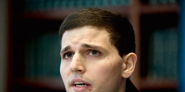 FILE - In this June 8, 2015 file photo, James Vivenzio speaks during a news conference in Philadelphia. Vivenzio, a former Penn State student from Great Falls, Va., who is suing over alleged hazing by his former fraternity, toured the fraternity house with his parents and lawyers for the involved parties seeking evidence for the case. (AP Photo/Matt Rourke, File)