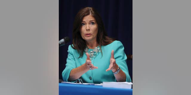 In this June 23, 2014 file photo, Pennsylvania state Attorney General Kathleen Kane fields questions from the media at a news conference in Harrisburg, Pa. Kane said Wednesday, Nov. 12, 2014 four of her employees have been fired and 11 suspended without pay for involvement in a pornographic email scandal that also prompted a state Supreme Court justice to step down. (AP Photo/Bradley C Bower)