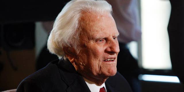 FILE - In this Dec. 20, 2010, file photo, Rev. Billy Graham is interviewed at the Billy Graham Evangelistic Association headquarters in Charlotte, N.C. Graham plans to celebrate his 96th birthday, on Friday, Nov. 7, 2014, with family and friends. Last year, 900 people attended a two-hour party for Graham at an Asheville hotel. His son, the Rev. Franklin Graham, said Wednesday that his father is in good spirits, he's eating well, and his mind is still sharp. (AP Photo/Nell Redmond, File)