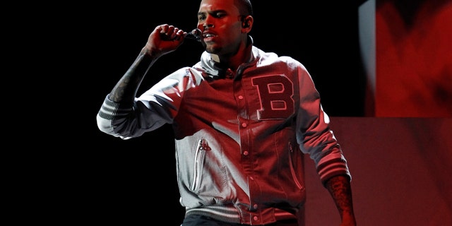Feb. 12, 2012: File photo: Chris Brown performs during the 54th annual Grammy Awards, in Los Angeles. A judge in Los Angeles ordered a further review of Brown's community service on Monday, Sept. 24, 2012.