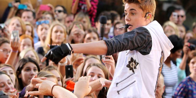 Justin Bieber garnered his fourth number one album this week with his new release, "Believe". (AP Photo/Starpix, Amanda Schwab)