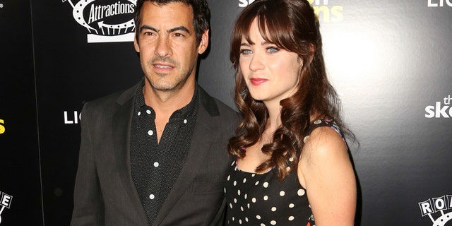 In this Sept. 10, 2014 file photo, Jacob Pechenik, left, and Zooey Deschanel attend