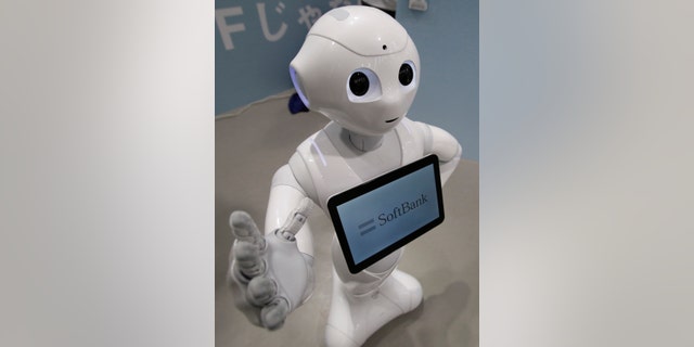 SoftBank's human-like robot named 'pepper' is displayed at its branch in Tokyo June 6, 2014.