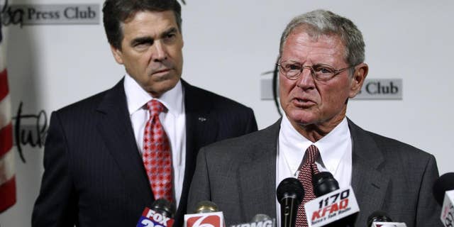 Sen. Jim Inhofe, R-Okla., right, introduces Republican presidential candidate, Texas Gov. Rick Perry, at a news conference in Tulsa, Okla., Monday, Aug. 29, 2011. (AP Photo/Sue Ogrocki)
