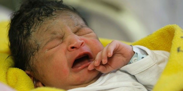 Oct. 31, 2011: Newborn girl Yazuri Tarmeno -- one of several people worldwide named the 7 billionth born on the planet -- cries after being born at the Maternity hospital in Lima, Peru.