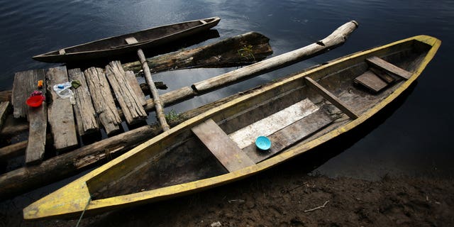 IQUITOS, PERU - JUNE 08: A view of two river boats on June 8, 2007 in Iquitos, Peru. This pristine river and massive rainforest is under threat from infrastructure development in Peru. The Achuar Indian people of this Northern region recently won a legal battle with Argentinian Oil giant PlusPetrol to stop them dumping waste oil water, so called "hot-water" into their water supply. The amount is estimated at around 500 000 barrels a day over a period of 30 years. This has played havoc with the eco-systems around the town of Trompeteros. The oil company has yet to make good on its promises for payment and transparency. The oil company provides the bulk of employment for the polluted town of Trompeteros and thus has the local Achuan population under pressure to not pay attention to the pollution levels. The Achuan people are faced with a choice between a centuries old sustainable lifestyle in harmony with the environment or a move towards increased devastation of their natural lands in the Amazon basin by the oil industry. (Photo by Brent Stirton/Getty Images)