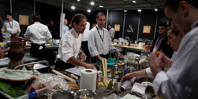 MADRID, SPAIN - JANUARY 26: Peruvian Chef Pedro Miguel Schiaffino (3L) and his team prepares the food before a lecture on the third day of 'Madridfusion' International Gastronomic Fair in the 'Palacio de los Congresos' on January 26, 2012 in Madrid, Spain. (Photo by Pablo Blazquez Dominguez/Getty Images)