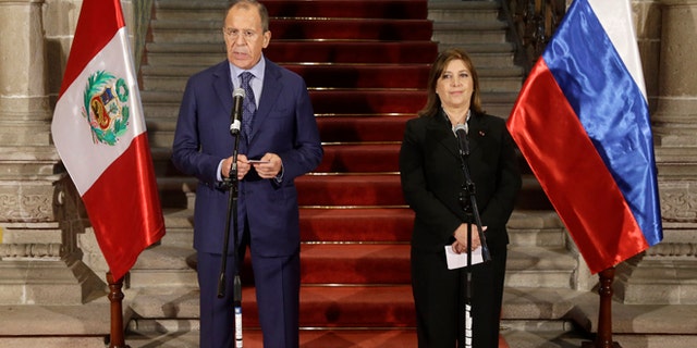 Russian's Foreign Minister Sergey Lavrov, talks during a joint press conference, next to Peru's Foreign Minister Eda Rivas at the Foreign Ministry building in Lima, Peru, Wednesday, April 30, 2014. Lavrov is Lima, for a visit of one day in his tour of Latin America. (AP Photo/Martin Mejia)