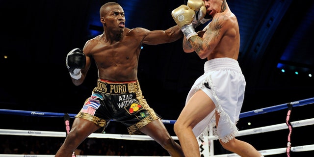 ATLANTIC CITY, NJ - OCTOBER 26: "Kid Chocolate" Peter Quillin punches Gabriel Rosado during their middleweight fight in Boardwalk Hall Arena on October 26, 2013 in Atlantic City, New Jersey. (Photo by Maddie Meyer/Getty Images)