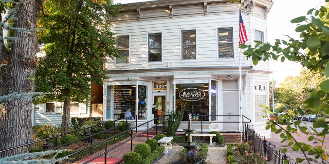 On October 6, 2017, the American Flag hangs outside of Grubb's Pharmacy in Northeast, Washington D.C. Grubb's Pharmacy, established in 1867 is the oldest pharmacy in D.C., and with its convenient location to The U.S. Capitol, services many Members of Congress.