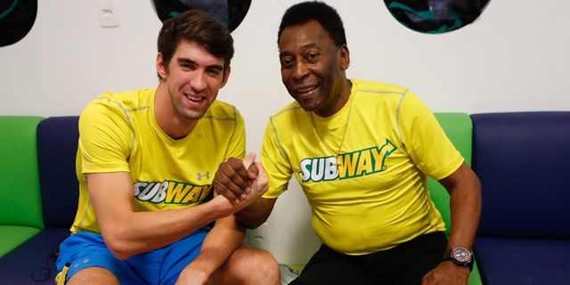 Michael Phelps and Pele at a press conference to promote healthy lifestyle among children on December 04, 2013 in Sao Paulo, Brazil.